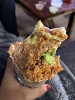 Almost done, still only rice and beans with a chunk of avocado appearing.