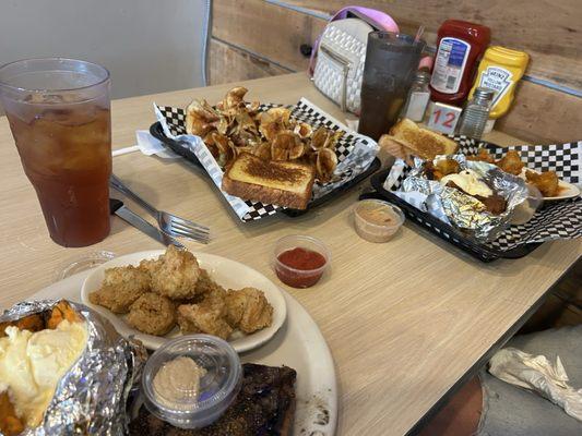 Surf and turf with a sweet potatoes ,butterfly fries loaded and bang bang shrimp with a sweet potato.