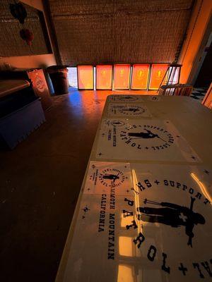 Screen printing transparencies and exposed screens ready for production.