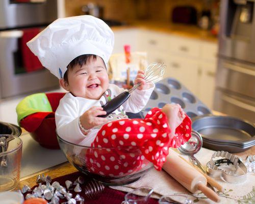Baby "helps" make Christmas cookies