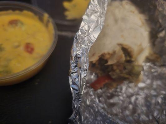 Low quality ingredients along with the cheese in the Queso.