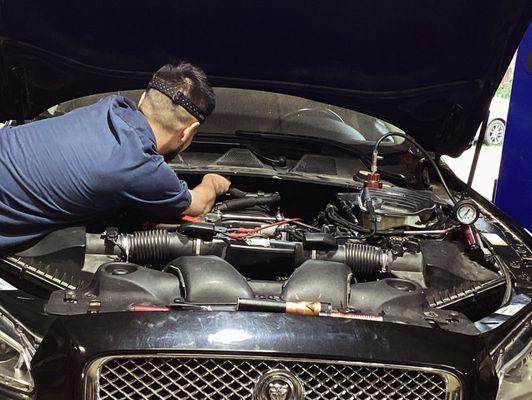 One of our technicians working on a Jaguar.