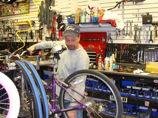 Jeff Carlson, owner of The Bike Shop, working on a bike. We have great prices on bike repairs.