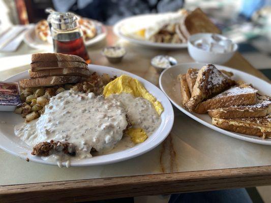 Chicken fired stake and eggs with country potatoes and French toast