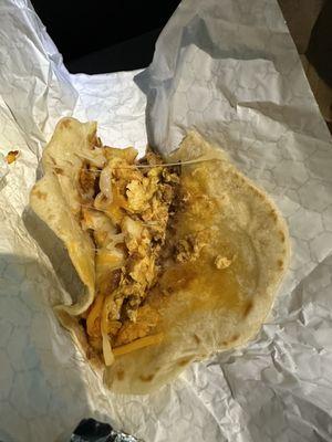 Chorizo & egg taco with jalapeño potatoes, refried beans and cheese