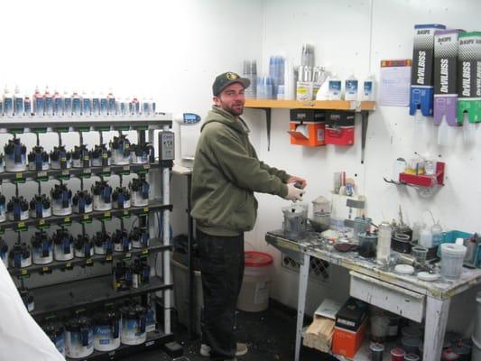 Flint in the paint lab mixing it up