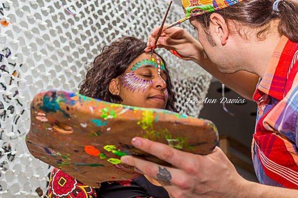 Futuristic FacePainter at work providing face painting services.