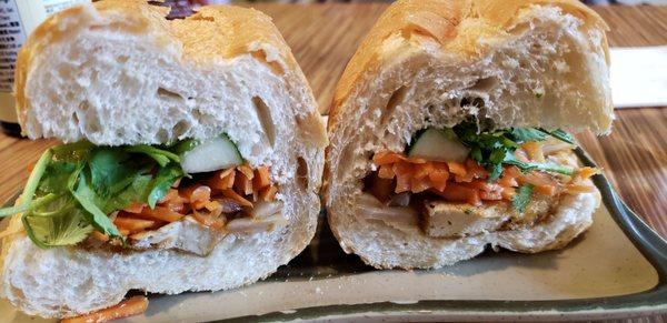 Tofu banh mi, vegan w/o butter ($4). Warm, flaky, perfect bread. Nicely spiced tofu. Best banh mi in the US, no joke.