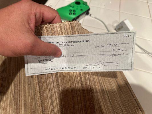 The very short paid hand written, lacking professionalism check that this garbage company sent me.