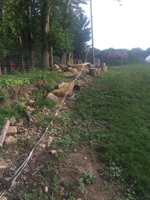 High voltage electric line laying on the ground. Doesn't seem like a good corner to cut. Do the right thing!