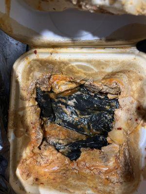 Melted cardboard that got mixed with wings. Safety and food hazard