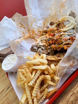 Gyro Sandwich w/giardiniera and fries. Tzatziki sauce in the small container.