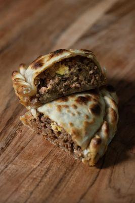 Traditional Argentine beef empanadas -- golden, juicy, and baked fresh at Banchero Express Weston.