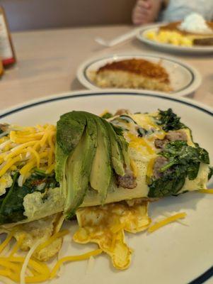 Make your own omelet with sausage, spinach, and avocado