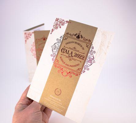 Red metallic foil stamp with gold metallic ink on cardstock