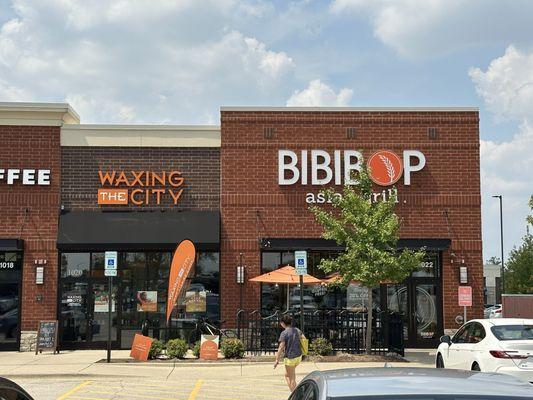 Outside of building between Starbucks and Bibibop