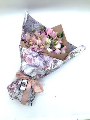 Custom bouquet designed with pink roses Lisianthus Cymbidium orchid