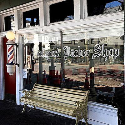Sidewalk view of Northport Barber Shop