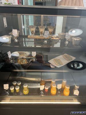 Cold pressed juices, quiche, parfait with organic blueberries and chia seeds.