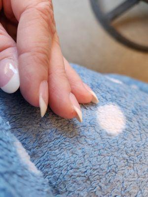 One cut finger. Polish on thumb doesn't cover all of nail.