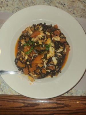 Squid ink pasta and crab