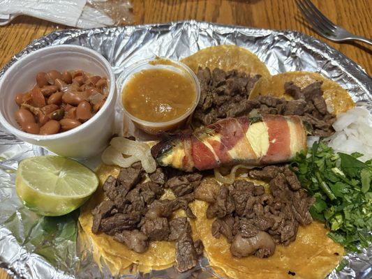 Fajita taco plate with beans and rice.