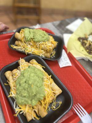 The beef roll tacos with guacamole and cheese
