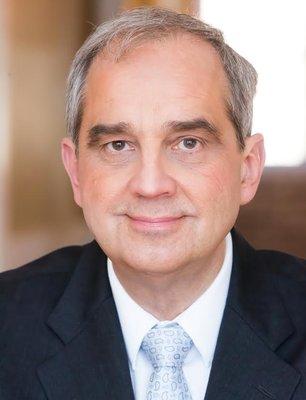 This is a photo of the principal partner, founding attorney, and owner, Bernard J. Michna.