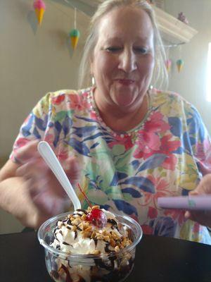 My friend enjoying her hot fudge sundae.