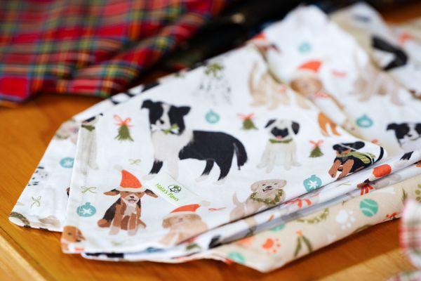 We carry handcrafted Holiday dog bandanas.