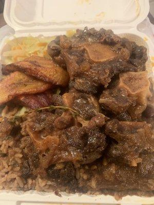 Oxtail, plantain, cabbage , rice & peas