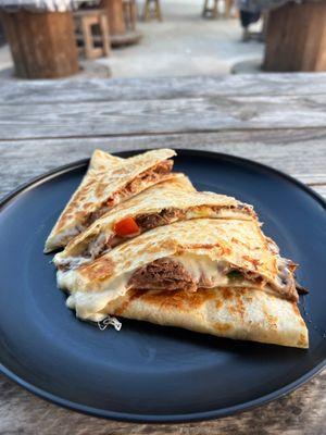 Brisket quesadilla with Salvadorian quesillo.