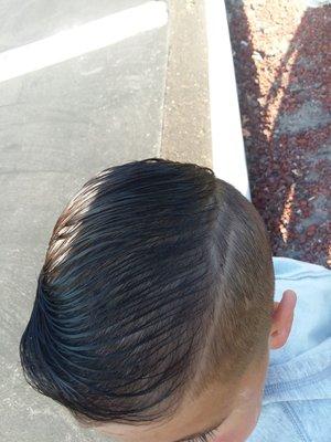 Upsetting! She butchered his hair for his 1st day of school. Avoid this rude place. She rushed through the cut.