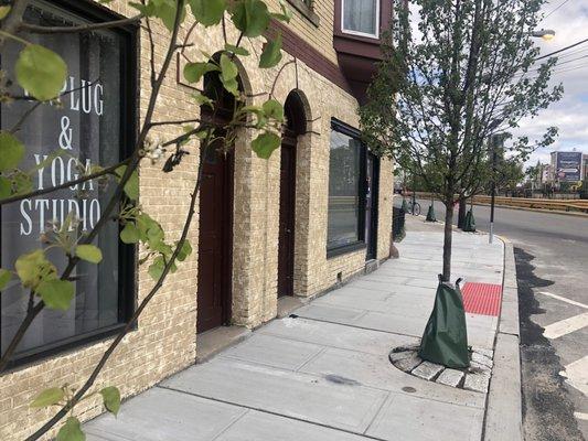 Outside. Parking lot end of the building.