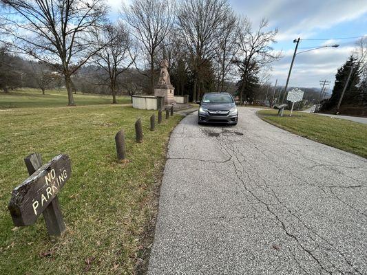 "No parking" posted on both sides of this monument. There is no other parking.