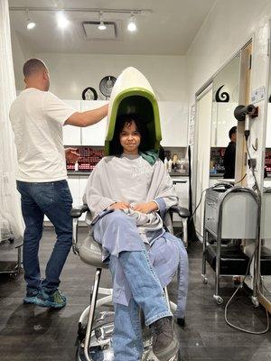 Getting her hair done