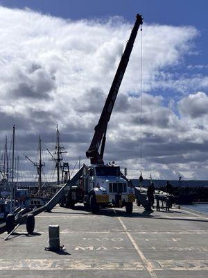 The crane unstepping our rig.
