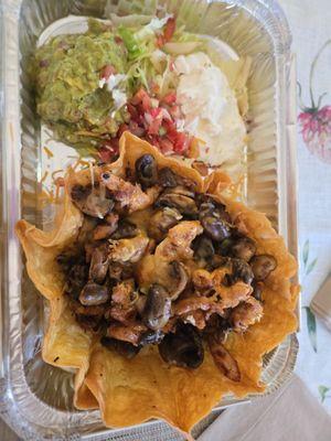 Pollo asada salad - takeout. (Yes, there is lettuce under all that chicken and mushroom mix!)