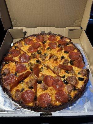 Large pie with pepperoni, sausage and olives.