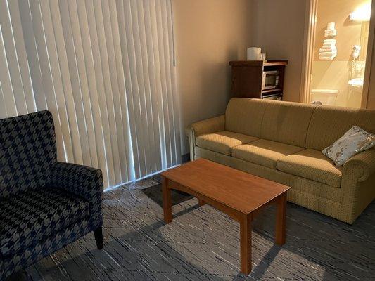 Living room area with flat screen TV.