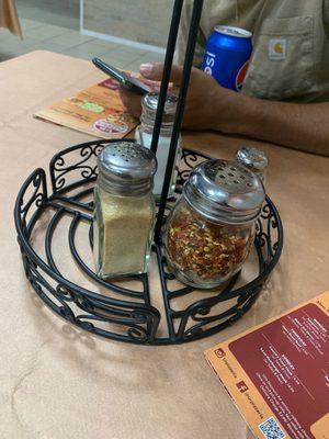 The essentials. Red pepper flakes, parmesan cheese, salt, and pepper.