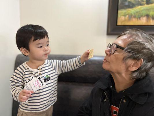 Leo feeding grandma in the hospital cafeteria.