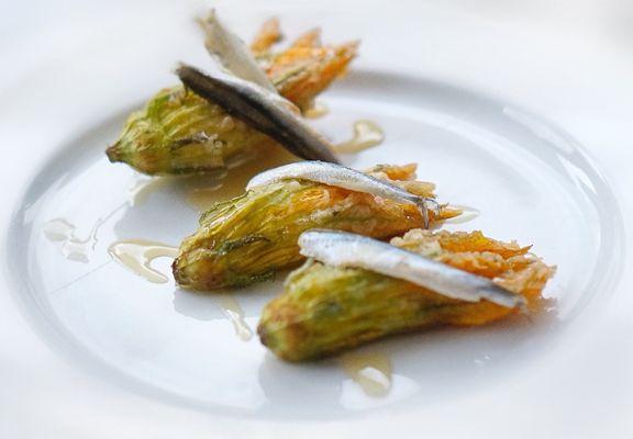 Lightly fried squash blossoms filled with ricotta, topped with fresh baby anchovies & drizzled with honey.