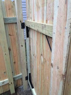 The fence "door" that was done by the owner.