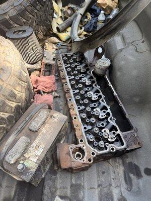 Pieces of the engine chucked into the bed of the truck