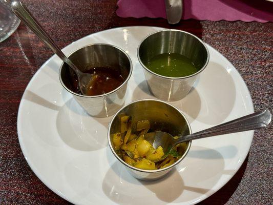 Complimentary Papadum with condiments. By the time I got the phone out the Papadum was gone.
