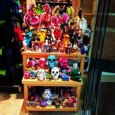Cute colorful section of sugar skulls & dia de los muertos gifts.