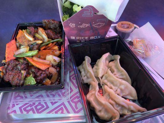 Mongolian beef with vegetables, broccoli side, and steamed dumplings