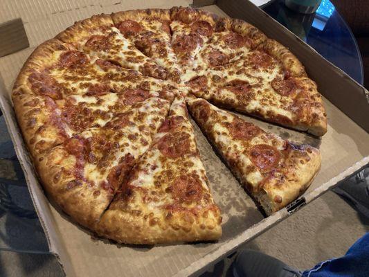 Pepperoni pizza with extra cheese and buttery crust