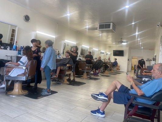 THE BARBERSHOP HAIR CUTTING STATIONS !!! Kimiko & Jay in action cutting hair. Best place in town and prices are reasonable.